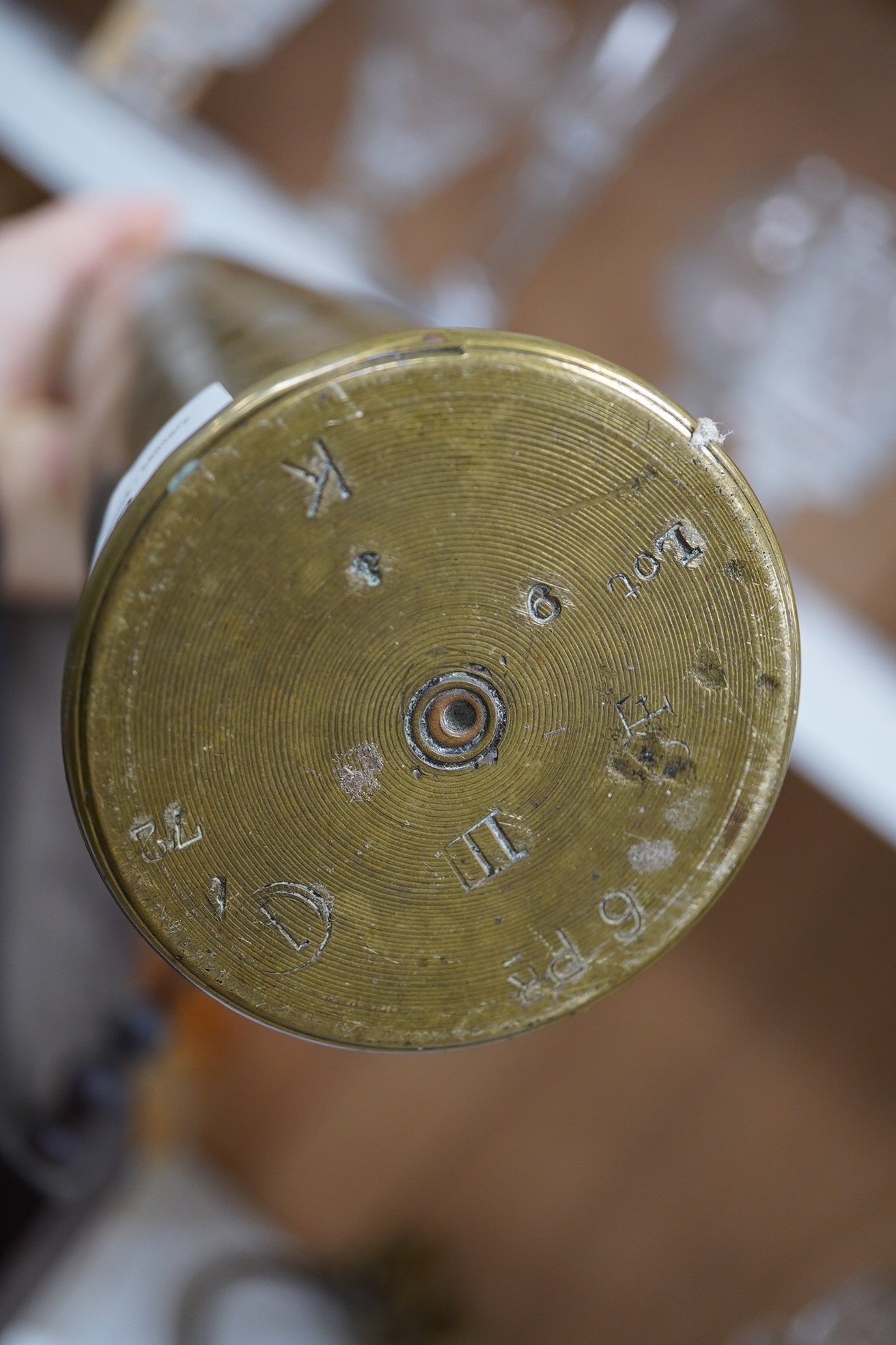 Two clocks including an American example, with keys and two military interest brass shells. Condition - fair